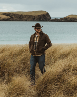 Bear&Wolf founder Jake Green in Shetland, wearing the Raven Cairn Overshirt