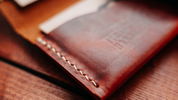 Close-up detail of a Bear&Wolf Leather Cardholder, showing the hand-stitched edge.