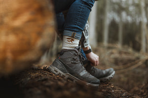Bear&Wolf Merino Rambler Socks in Natural, worn with hiking shoes on a Scottish trail.