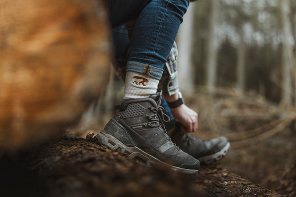 Bear&Wolf Merino Rambler Socks in Natural, worn with hiking shoes on a Scottish trail.