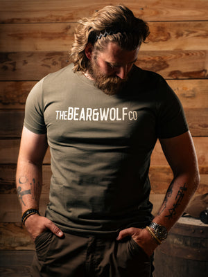 Man wearing Bear&Wolf organic cotton logo tee in Forest, front view