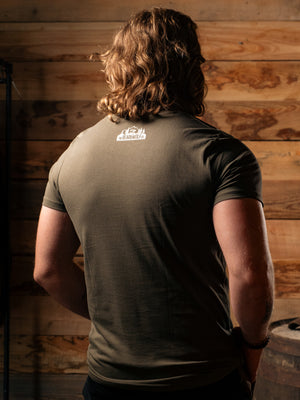 Man wearing Bear&Wolf organic cotton logo tee in Forest, back view
