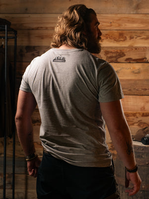 Man wearing Bear&Wolf organic cotton logo tee in Slate, back view