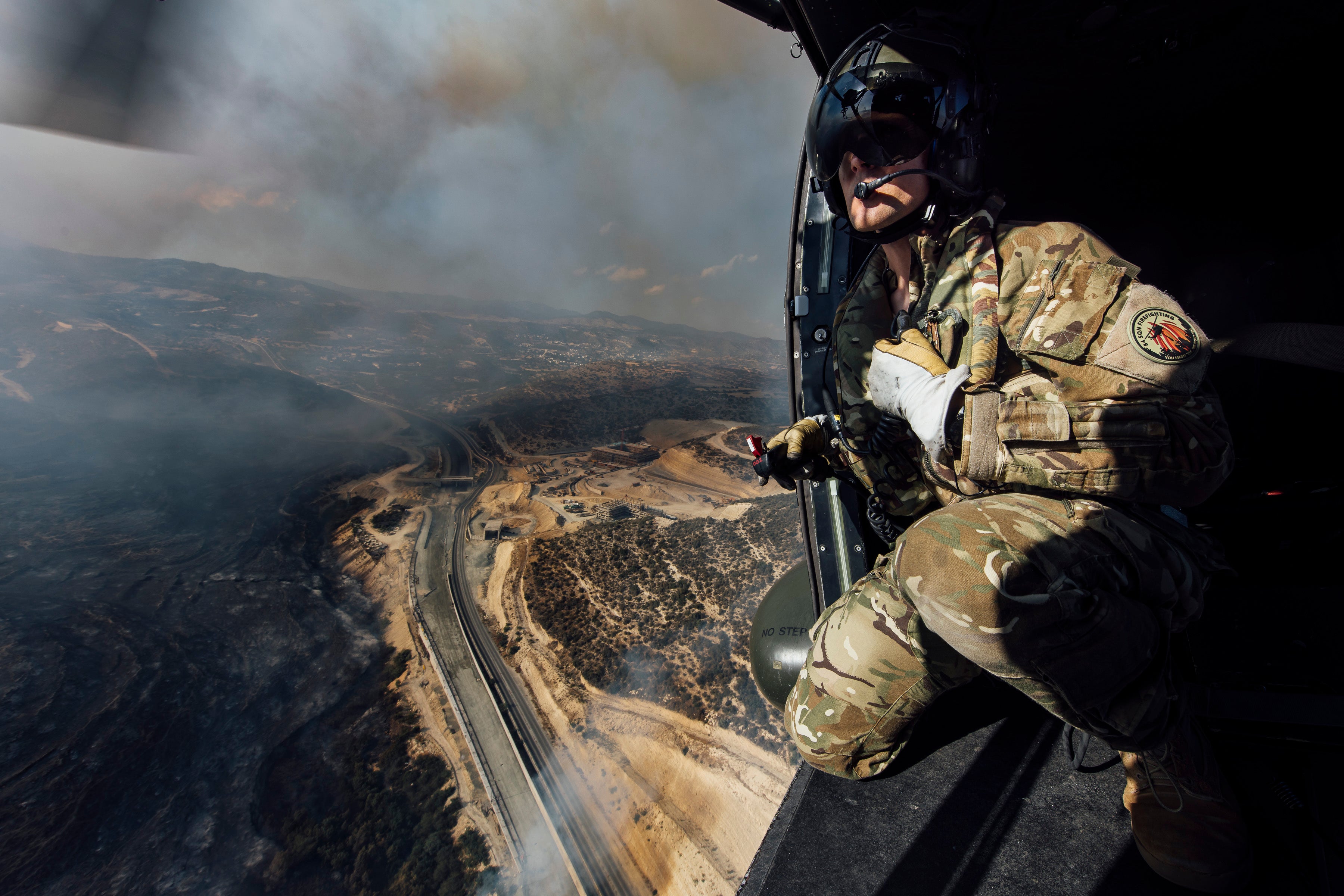 RAF 84SQN Crewman overlooking the Cyprus wildfire during fire fighting near RAF Akrotiri