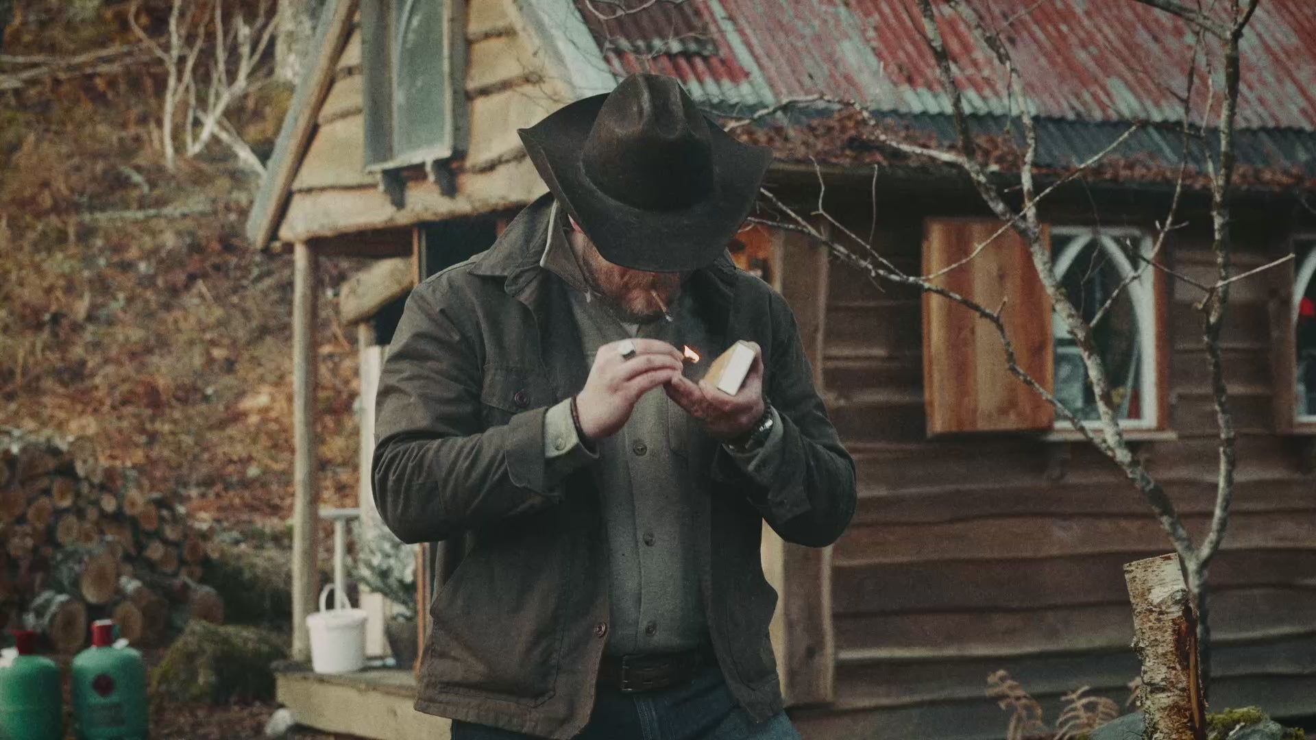 British heritage outdoor brand Bear&Wolf - founder Jake at a Scottish cabin wearing the Cairn Overshirt.