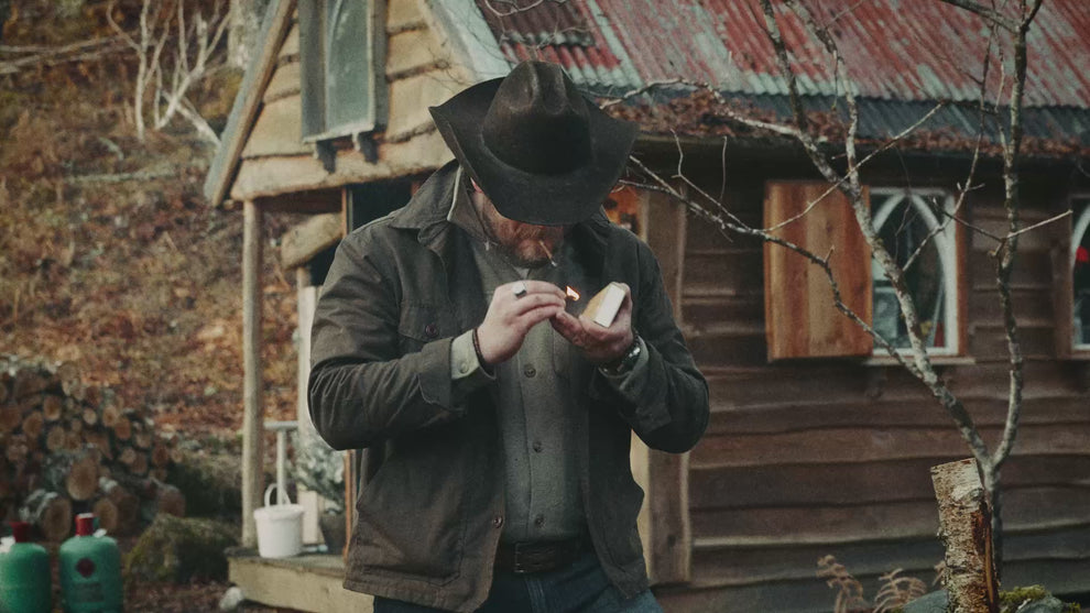 British heritage outdoor brand Bear&Wolf - founder Jake at a Scottish cabin wearing the Cairn Overshirt.