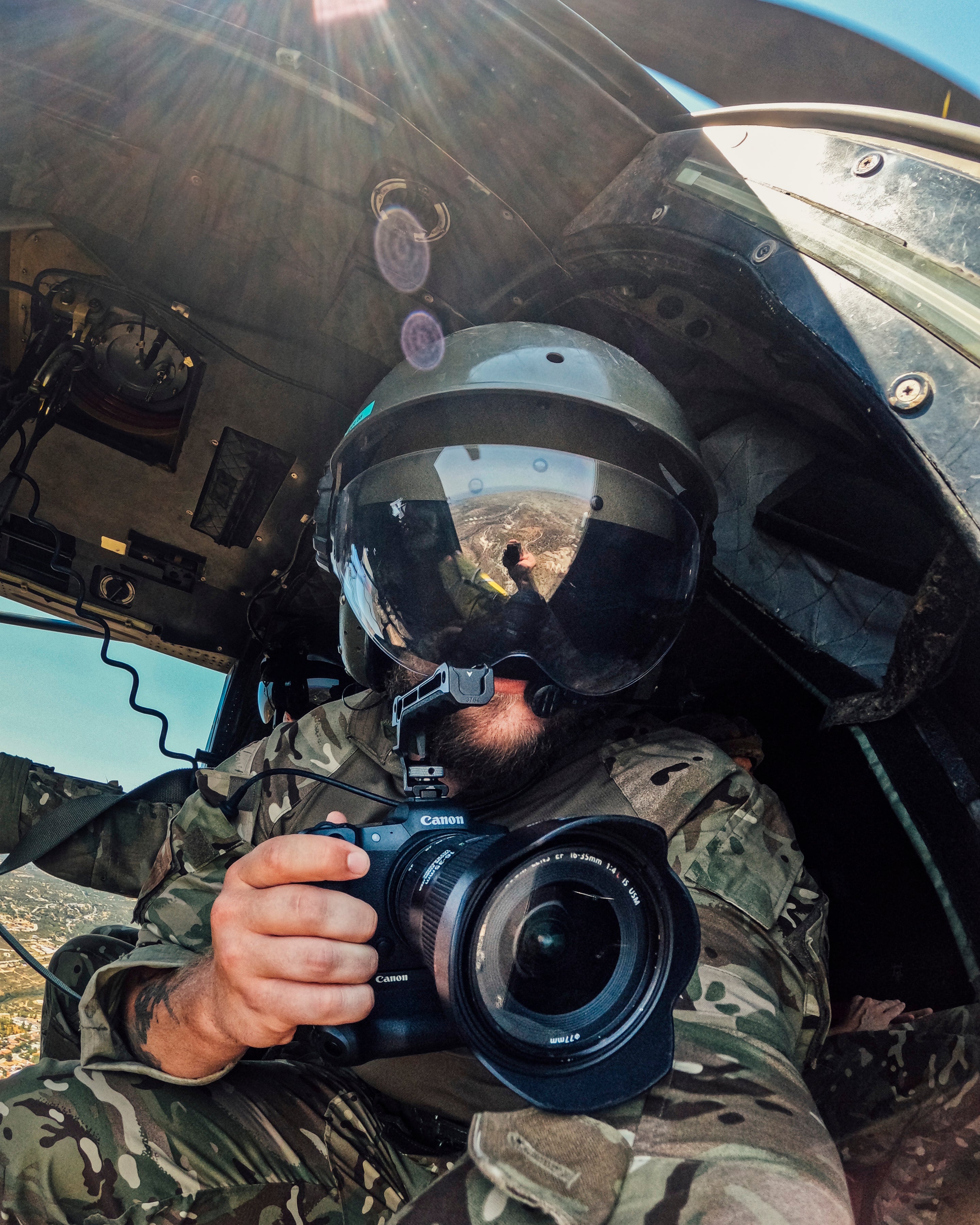 RAF Photographer Jake Green photographing from inside a military aircraft during his posting at RAF Akrotiri in Cyprus