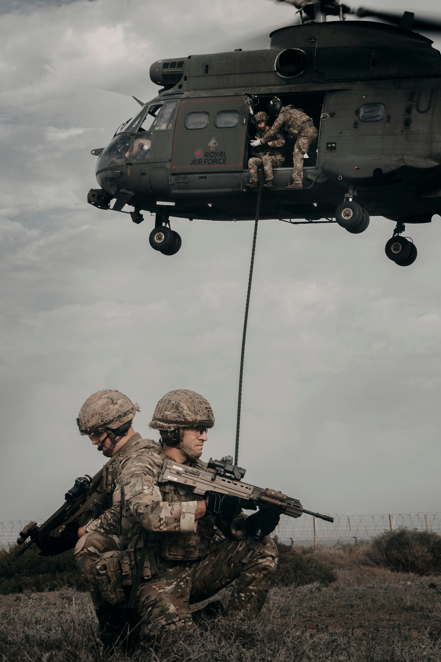 RAF Regiment personnel training with an RAF Puma helicopter during an exercise in Cyprus